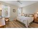 Bright bedroom featuring a ceiling fan, wood-look floors, and neutral tones at 722 Portofino Dr, Kissimmee, FL 34759
