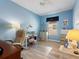 Inviting bedroom with bright blue paint and ceiling fan at 722 Portofino Dr, Kissimmee, FL 34759