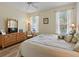 Bedroom with wood-look floors, comfortable seating, and ample natural light at 722 Portofino Dr, Kissimmee, FL 34759