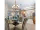 Open-concept dining area with views of kitchen and living spaces at 722 Portofino Dr, Kissimmee, FL 34759