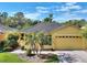 Charming single-story home with well-manicured lawn, beautiful landscaping and a two-car garage at 722 Portofino Dr, Kissimmee, FL 34759