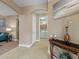 Inviting hallway with tile flooring leading to a laundry room with washer and dryer visible at 722 Portofino Dr, Kissimmee, FL 34759
