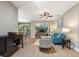 Bright living room with ceiling fan, modern furniture, and wood flooring at 722 Portofino Dr, Kissimmee, FL 34759