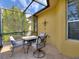 Covered patio with comfortable seating, ideal for outdoor dining at 722 Portofino Dr, Kissimmee, FL 34759
