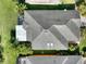 Aerial shot displaying the roof of the home, beautiful landscaping, and well-maintained grounds at 722 Portofino Dr, Kissimmee, FL 34759