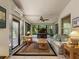 Bright sunroom with large windows, tile flooring and ceiling fan at 722 Portofino Dr, Kissimmee, FL 34759