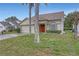 Two-story home with a garage, neatly landscaped lawn, and a front entrance decorated with a wreath at 723 Allison Ave, Davenport, FL 33897