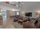 Bright and airy living room featuring high ceilings and views of the dining room at 723 Allison Ave, Davenport, FL 33897