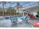 Inviting screened-in pool and patio area with lounge seating, ideal for relaxation and outdoor entertainment at 723 Allison Ave, Davenport, FL 33897