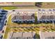 Aerial view of townhomes showcasing backyard, roof lines, and proximity to neighborhood amenities at 728 Madison Dr, Davenport, FL 33837