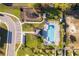 Community aerial featuring a pool, playground, cabana, parking, green space and manicured landscaping at 728 Madison Dr, Davenport, FL 33837