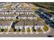 Aerial view of newly constructed neighborhood featuring multiple townhomes and construction zone at 728 Madison Dr, Davenport, FL 33837