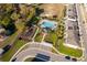 Community aerial featuring a pool, playground, cabana, parking, green space, townhomes and landscaping at 728 Madison Dr, Davenport, FL 33837