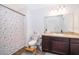 Bathroom featuring a shower with decorative curtain and a vanity at 728 Madison Dr, Davenport, FL 33837