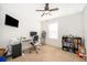 Bedroom set up with a desk, computer, chair, and bookshelf at 728 Madison Dr, Davenport, FL 33837