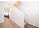 Bright entryway features carpeted floors and stairs, with a view into the living area at 728 Madison Dr, Davenport, FL 33837