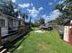 Lush backyard featuring a well-manicured lawn and patio, ideal for outdoor entertaining at 731 Trenton Rd, Lakeland, FL 33815