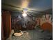This is a cluttered bedroom featuring a ceiling fan, bed, and lots of personal belongings at 731 Trenton Rd, Lakeland, FL 33815
