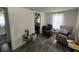 Inviting living room featuring neutral paint, gray wood-look floors, and comfortable seating at 731 Trenton Rd, Lakeland, FL 33815