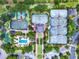 Stunning aerial view of a community with tennis courts, pool, and manicured grounds, offering resort-style living at 7412 Soiree Way, Reunion, FL 34747