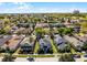 Beautiful neighborhood view featuring a two-story gray home with well-kept lawn, outlined in blue at 7412 Soiree Way, Reunion, FL 34747