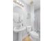 Bathroom with pedestal sink and toilet; plus a shower/tub and simple decor at 7412 Soiree Way, Reunion, FL 34747