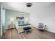 Bright bedroom featuring a queen-sized bed, stylish bedside tables, and cool-toned decor at 7412 Soiree Way, Reunion, FL 34747