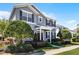 Inviting two-story home boasts of mature trees and lovely front yard landscaping at 7412 Soiree Way, Reunion, FL 34747