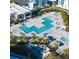 Aerial view of the modern apartment complex with multiple swimming pools and ample lounge areas at 7740 Sandy Ridge Dr # 1, Kissimmee, FL 34744