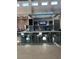 Lobby bar area featuring modern countertops, bar seating, and a television at 7740 Sandy Ridge Dr # 1, Kissimmee, FL 34744