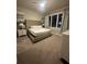 Bedroom featuring a king-size bed with a tufted headboard and coordinated artwork at 7740 Sandy Ridge Dr # 1, Kissimmee, FL 34744
