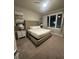 Bedroom featuring a king-size bed with a tufted headboard and coordinated artwork at 7740 Sandy Ridge Dr # 1, Kissimmee, FL 34744