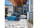 Inviting building entrance featuring modern outdoor furniture and a tranquil water feature at 7740 Sandy Ridge Dr # 1, Kissimmee, FL 34744