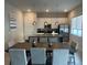 Eat-in kitchen with stainless steel appliances, island and open floor plan at 7740 Sandy Ridge Dr # 1, Kissimmee, FL 34744