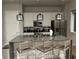 Modern kitchen with stainless steel appliances, a large island, and pendant lighting at 7740 Sandy Ridge Dr # 1, Kissimmee, FL 34744