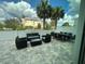 Outdoor patio area with modern furniture and a dining table, perfect for entertaining at 7740 Sandy Ridge Dr # 1, Kissimmee, FL 34744