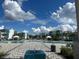 Resort-style pool area with cabanas, loungers and palm trees providing a relaxing oasis at 7740 Sandy Ridge Dr # 1, Kissimmee, FL 34744