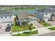 Aerial view of a single-story home with gray paint near a lake at 7793 Clove Hitch Way, Orlando, FL 32832