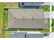 Aerial view of a well-maintained roof, surrounded by lush greenery and neighboring homes at 7793 Clove Hitch Way, Orlando, FL 32832
