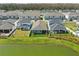 Picture perfect aerial shot featuring backyard views of homes near a tranquil pond and verdant green lawns at 7793 Clove Hitch Way, Orlando, FL 32832