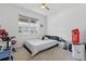 Bright bedroom with neutral carpet, a window and a punching bag at 7793 Clove Hitch Way, Orlando, FL 32832