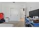 Bright bedroom with neutral carpet, closet with sliding doors, and a view of the tiled hallway at 7793 Clove Hitch Way, Orlando, FL 32832