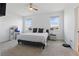 Spacious bedroom features natural light from two windows and neutral carpet at 7793 Clove Hitch Way, Orlando, FL 32832