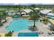 A large community pool with ample lounge seating and shaded areas at 7793 Clove Hitch Way, Orlando, FL 32832