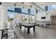 Spacious game room with a pool table and ping pong table, offering a fun and recreational space at 7793 Clove Hitch Way, Orlando, FL 32832