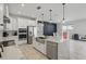 Well-equipped kitchen with marble countertops, stainless steel appliances, a farmhouse sink, and open access to dining at 7793 Clove Hitch Way, Orlando, FL 32832