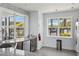 A kitchenette with stainless steel appliances and a view of the pool at 7793 Clove Hitch Way, Orlando, FL 32832