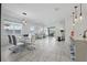 Spacious open living area with combined living, dining, and kitchen, ideal for entertaining and Gathering gatherings at 7793 Clove Hitch Way, Orlando, FL 32832