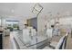 Open-concept living space featuring modern furniture, an open floorplan, and an island bar with kitchen at 7793 Clove Hitch Way, Orlando, FL 32832