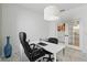 Office with a desk, rolling chair, and double doors leading to another room at 7793 Clove Hitch Way, Orlando, FL 32832